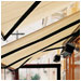 A retractable awning with a clear drop curtain create a comfortable seating area for Rose's Cafe, Alamo, CA.