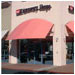 An arched awning invites customers to the Discovery Shop at the Fremont Hub Shopping Center.