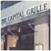 A curved stainless steel awning and signage suggest business discussions over lunch at The Capital Grille in San Francisco.